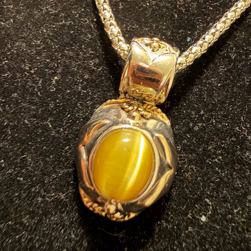 Silver snd Gold Pendant with a Peridot Green Center Stone and Silver Necklace